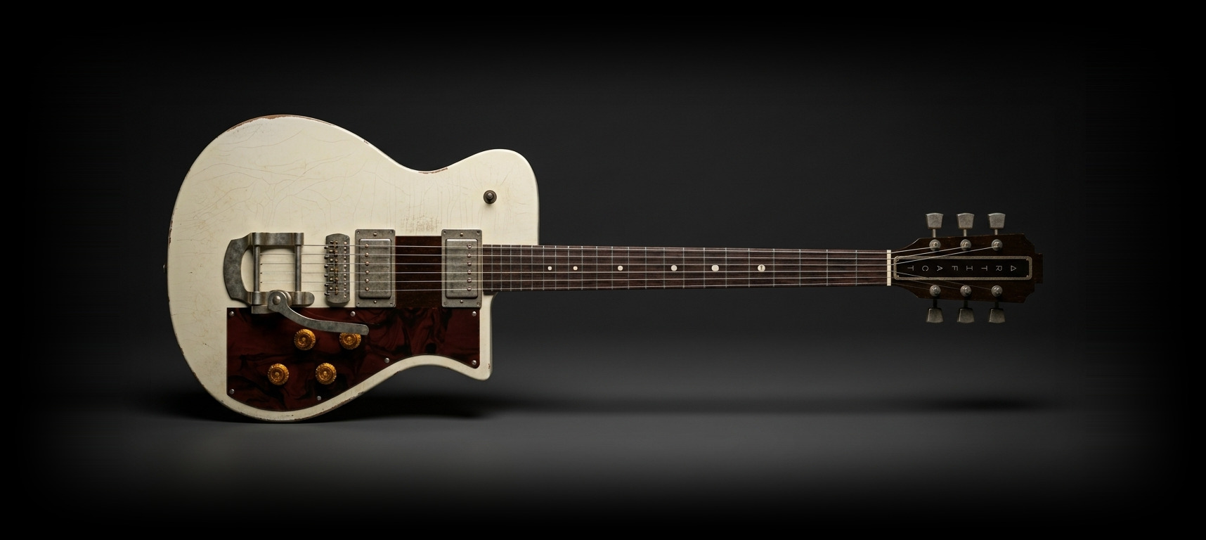 The Artifact in aged Olympic White, boutique electric guitar
