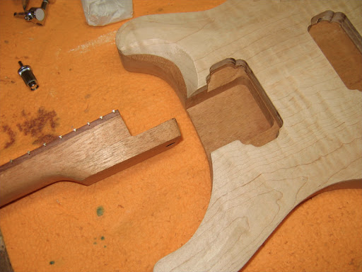 PRS-style set-neck joint, wide, flat, and precise