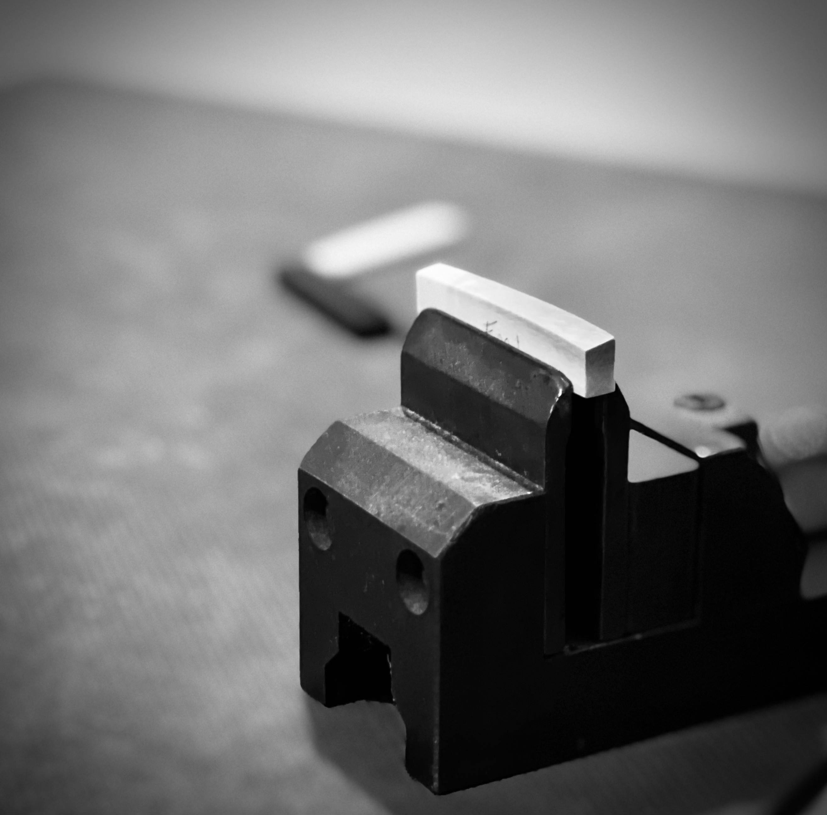 Siberian mammoth nut blank held in a vise